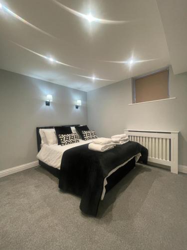 a bedroom with a large bed in a room at Central Windsor in Windsor