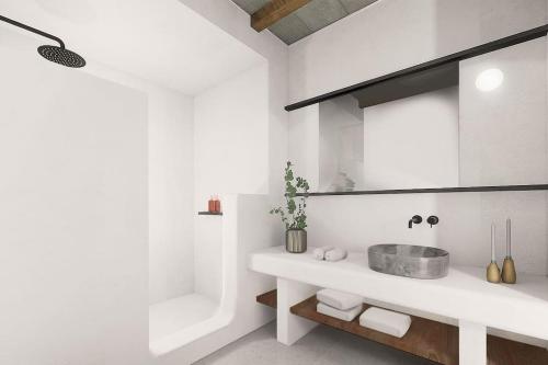 biała łazienka z umywalką i wanną w obiekcie Seascape, Suite 3 with sea view w mieście Áno Meriá
