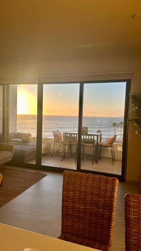 a living room with a view of the ocean at Luxury, Ocean View, Pool, Jacuzzi, Valle de Guadalupe, Los Portales De Garcia, Splash, Encanto Restaurants, Surf Breaks in Primo Tapia, Rosarito in Rosarito
