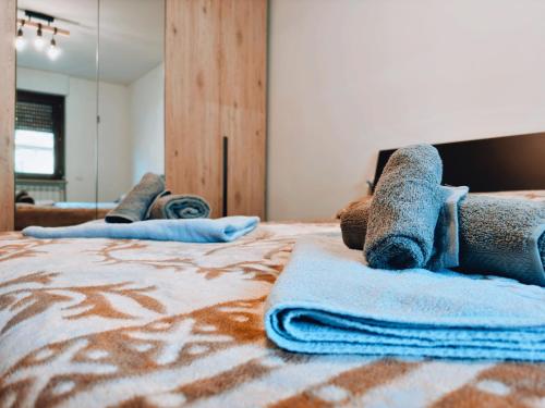 a bedroom with a bed with towels on it at Finestra su Villalago in Villalago