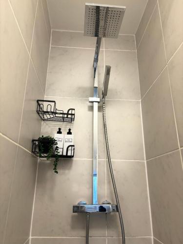 a shower in a bathroom with a shower at Cardiff/Penarth Home in Cardiff