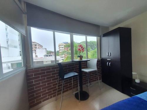 R.1102 Lindo estudio ejecutivo en área turística.にあるベッド