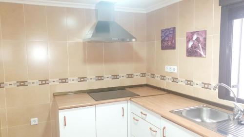 a kitchen with a sink and a counter top at Ave Maria Toledo in Toledo