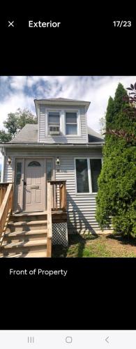 a front of a house with a front of property at LOVELY RENOVATED 2 BEDROOM HOME WITH FREE Parking in Albany