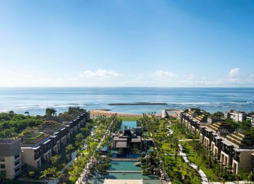 an aerial view of a resort with the ocean in the background at The Apurva Kempinski Bali in Nusa Dua