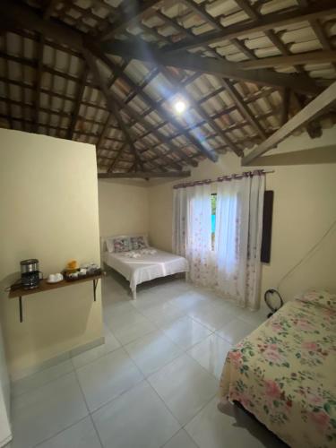 a bedroom with two beds and a ceiling at ALOHA - PRAIA DO SONO - in Paraty