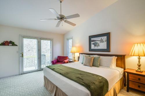 a bedroom with a bed and a ceiling fan at Charming Galena Townhome Near Belvedere Mansion! in Galena