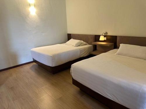 Postel nebo postele na pokoji v ubytování Afamosa Resort Dsavoy Condo