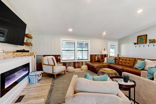 a living room with a couch and a tv at Lake Buchanan Living in Burnet