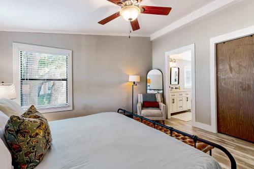a bedroom with a bed and a ceiling fan at Lake Buchanan Living in Burnet