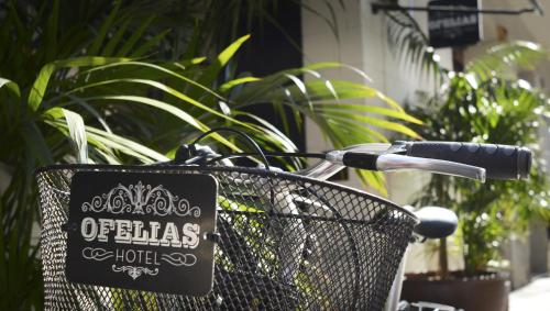 a basket on a bike with a sign on it at Ofelias Hotel 4Sup in Barcelona