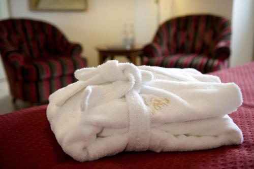 a pile of towels sitting on top of a table at Grand Hotel Lund in Lund