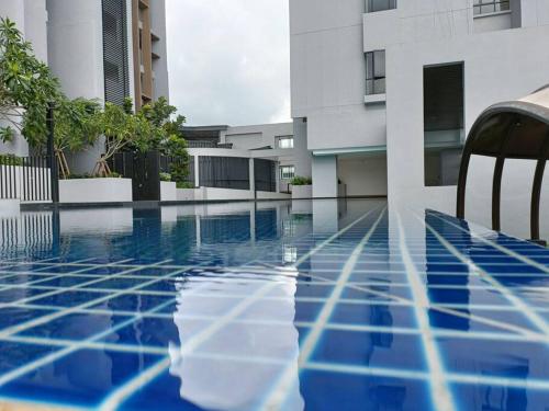 a view of a swimming pool in a building at Cozy Sky Trees 4 Guests, Balcony, Netflix and Big TV A08 in Johor Bahru