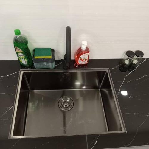 a kitchen sink with detergent and a detergent at Cozy Sky Trees 4 Guests, Balcony, Netflix and Big TV A08 in Johor Bahru