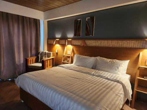 Ένα ή περισσότερα κρεβάτια σε δωμάτιο στο Acacia Garden Inn and Suites