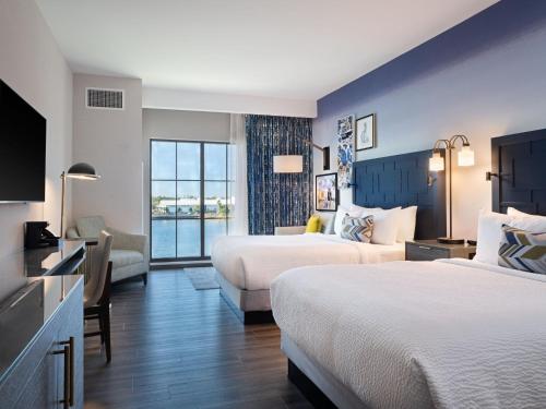 a hotel room with two beds and a television at Hotel Indigo - Panama City Marina by IHG in Panama City