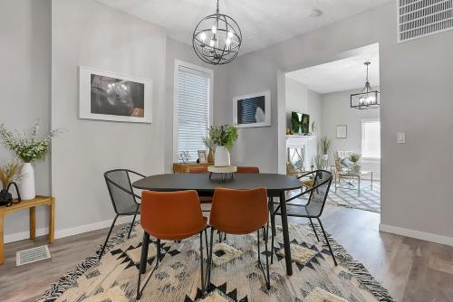a dining room with a table and chairs at Housepitality - The Olive - 4 BR 2 Bath in Columbus
