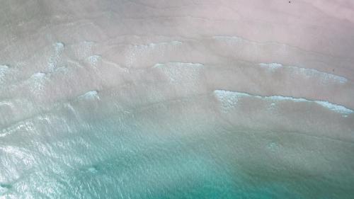 an aerial view of the ocean and the beach at Villa Darroca Palawan in Araceli
