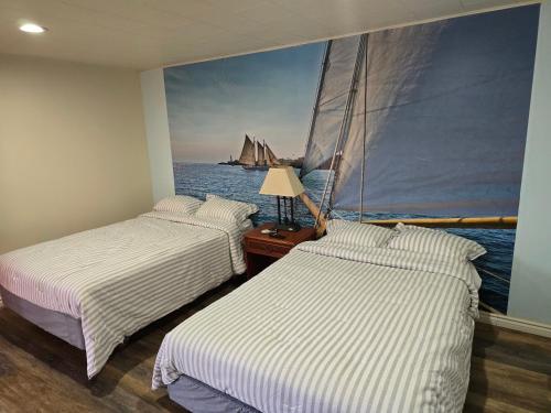Postel nebo postele na pokoji v ubytování Stardust Motel