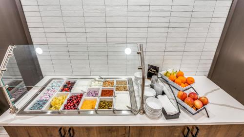 a buffet with many different types of food on a table at Holiday Inn Dallas Market Ctr Love Field by IHG in Dallas