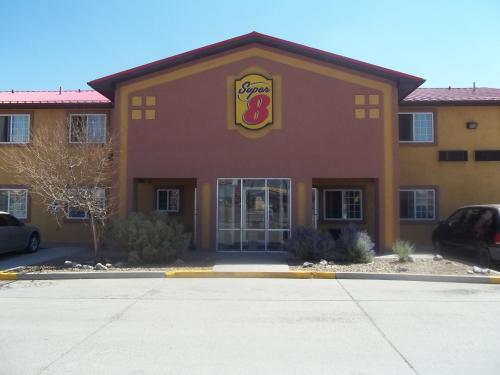 a fast food restaurant with a sign on the front of it at Super 8 by Wyndham Moriarty in Moriarty