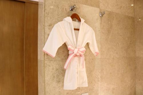a robe on a hanger in a shower at Crowne Plaza Hefei Rongqiao, an IHG Hotel in Hefei