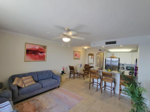 a living room with a couch and a table at Lakeview Condo Hotel near Disney in Orlando