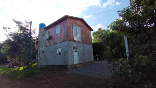 an old barn with a red roof at Alojamiento Matheo in El Soberbio