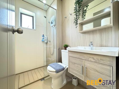 a bathroom with a toilet and a sink and a shower at Youth City Residence Family Suite KLIA AEON Mall Nilai USIM in Nilai