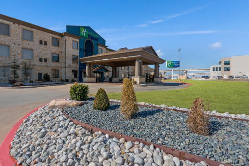 a hotel front of a building with a landscaping at Holiday Inn Express & Suites Oklahoma City NW - Quail Springs by IHG in Oklahoma City