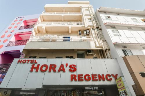 a hotel honors recovery sign in front of a building at OYO Flagship Horas Regency in Rānchī