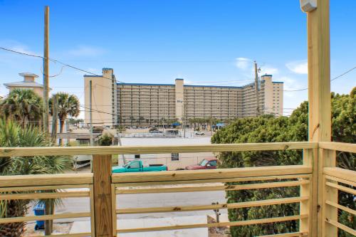a view of a large building from a balcony at OceanView Oasis - Relax with Hot Tub, Breakfast, Fire Pit & Putting Green! in Panama City Beach