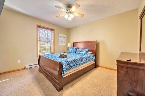 a bedroom with a bed and a ceiling fan at Pocono Pinnacle by AvantStay Steps to the Lake Game Room Large Deck in Albrightsville