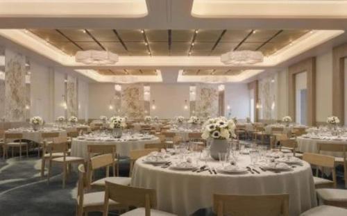 a banquet hall with white tables and chairs at Hotel Indigo Grand Cayman by IHG in Grand Cayman
