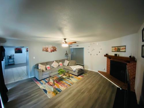 a living room with a couch and a fireplace at Munoz Home in Yuma