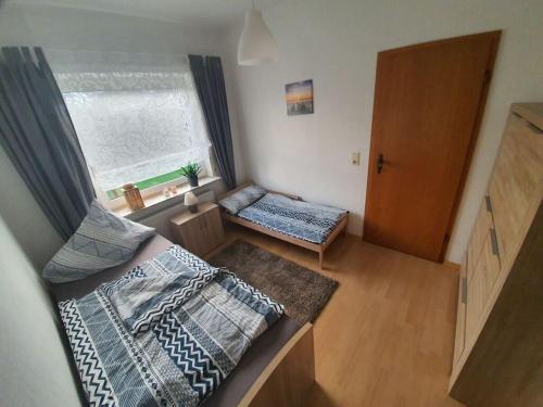 Katil atau katil-katil dalam bilik di Holiday home Nordseeglück