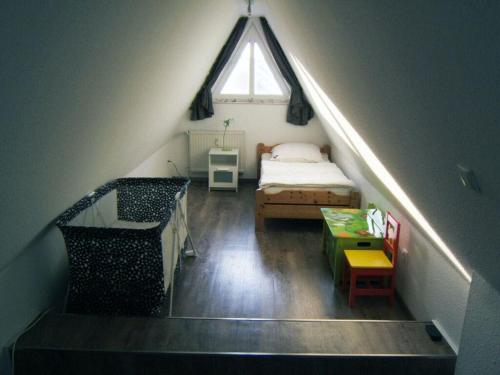 Un pat sau paturi într-o cameră la Pommernweg 15 Merchant