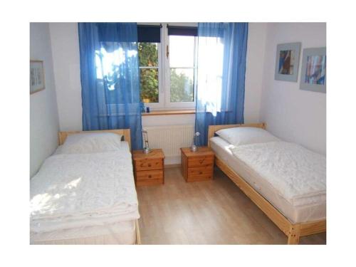 Un pat sau paturi într-o cameră la Heinrich Tiarksstrasse 36