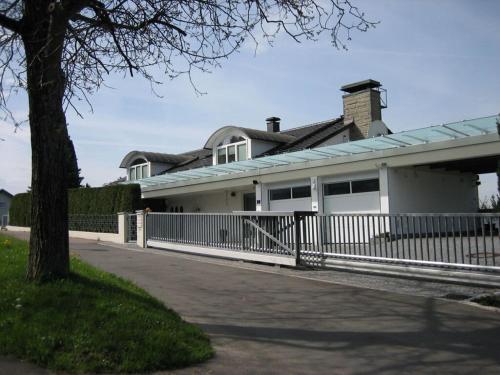 a house with a white fence in front of it at Hanssen in Lindau Lake Constance in Lindau