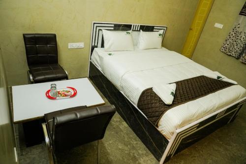 Postel nebo postele na pokoji v ubytování Green Residency