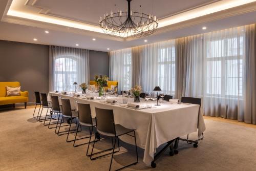a conference room with a long table and chairs at Nunne Boutique Hotel in Tallinn