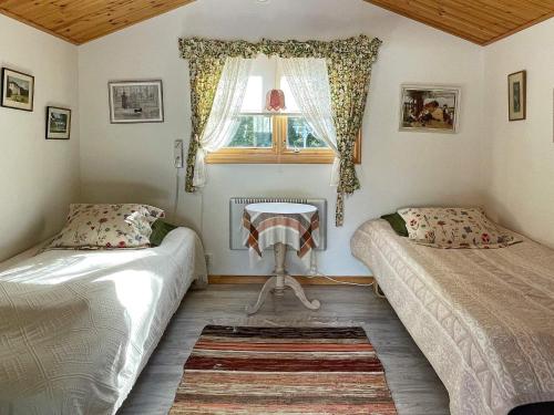 Un pat sau paturi într-o cameră la Holiday home GRISSLEHAMN XV