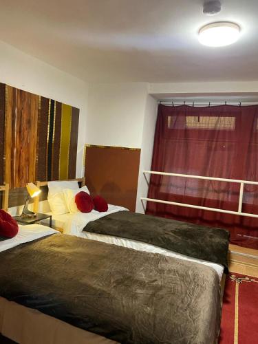 a hotel room with two beds and a window at Allaga City Center in Budapest
