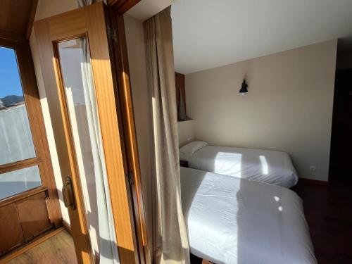 Ένα ή περισσότερα κρεβάτια σε δωμάτιο στο Hotel Cabo Ortegal