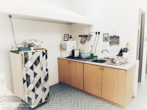 a kitchen with a sink and a counter at Hideaway ~ Best Memories start here! in Mersing