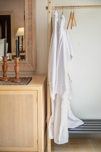 a bathroom with white towels hanging on a door at Vranas Ambiance Hotel in Chania Town