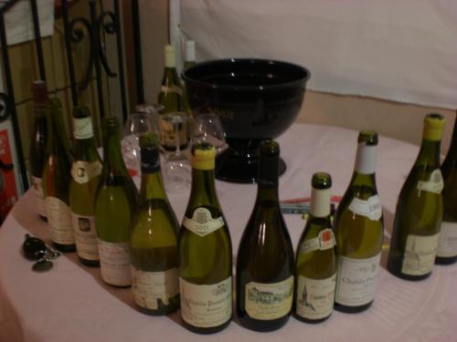 a group of bottles of wine sitting on a table at Auberge De L'Atre in Quarré-les-Tombes