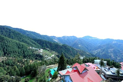 an aerial view of a village in the mountains at The Retreat Mashobra, Shimla in Shimla