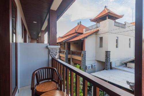 a balcony with a view of a building at Donahome in Sanur