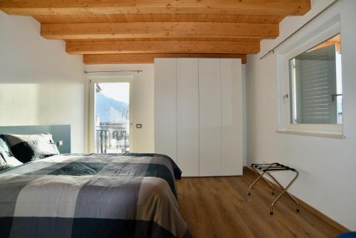 מיטה או מיטות בחדר ב-Appartamento Sogno Blu